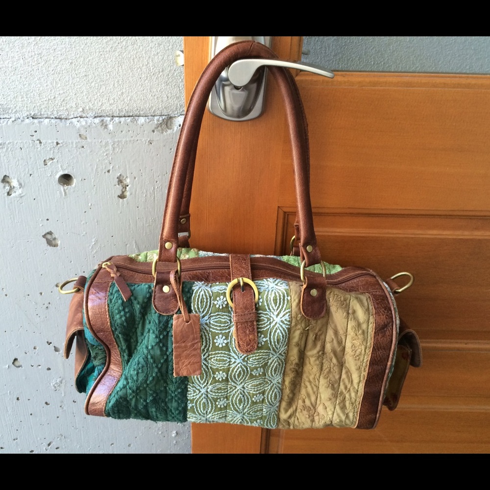 Darling embroidered Mo & Co duffle bag